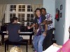 DOc & DARYL DAVIS sharing a guitar, ARI BORGER on the piano at 2011 Cincy Blues Fest Piano Party